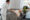 Caregiver assisting elderly client in a comfortable home setting, emphasizing personalized support and compassionate care.