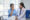 Elderly woman receiving companion care at home with caregiver offering support and conversation