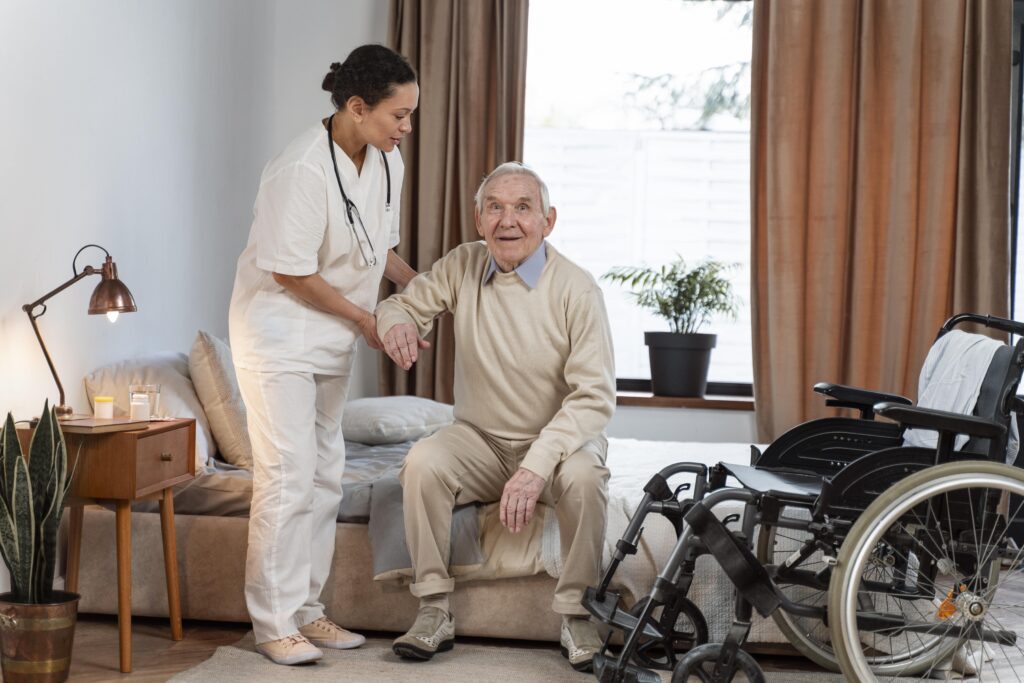 A caregiver gently assisting an elderly person at home