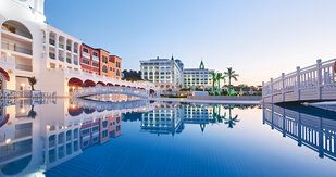 Image of a serene waterfront view showcasing buildings along the water, reflecting Lasting Legacy Healthcare's commitment to community and quality of life for seniors in Pasco County.