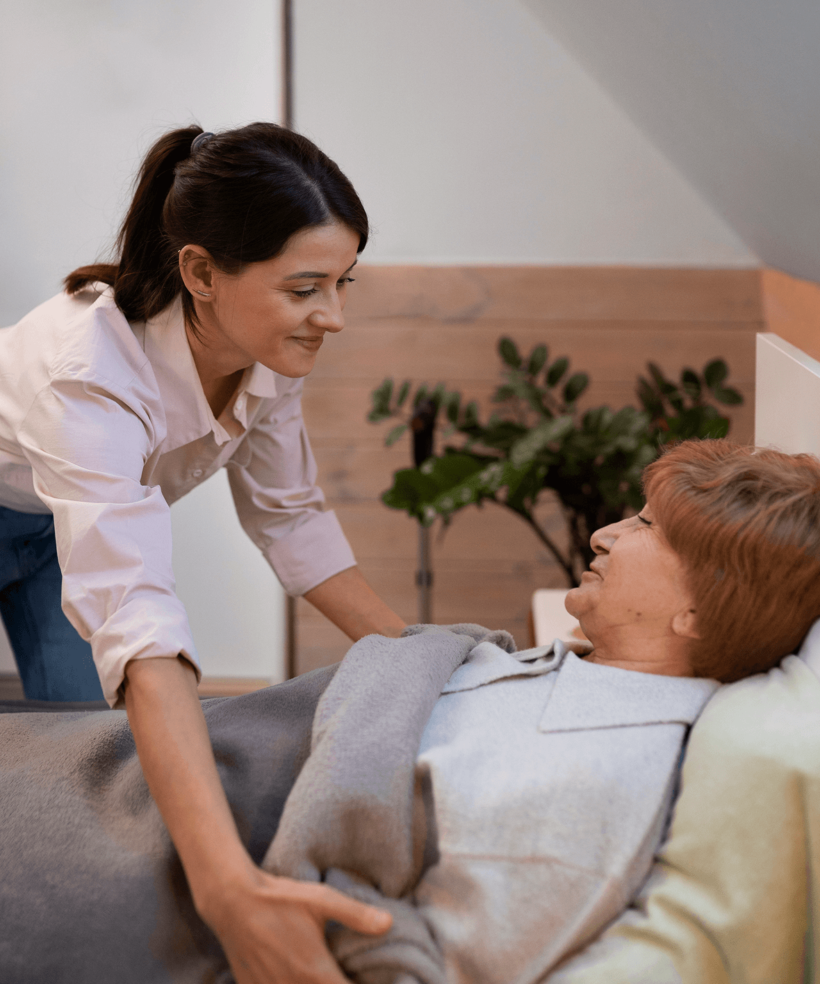 Home caregiver providing companionship and emotional support to elderly couple.