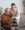 Professional home care provider assisting elderly client with daily living tasks.