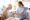 Caregiver providing compassionate in-home support to an elderly client, emphasizing personalized care and emotional well-being.