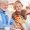 Caregiver assisting elderly woman with daily personal care routine at home