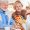 Caregiver assisting elderly woman with daily personal care routine at home